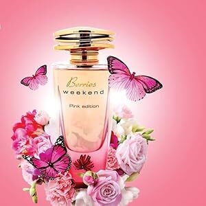 Perfume bottle with gold cap surrounded by purple butterflies, pink roses, and other flowers against a bright pink background.