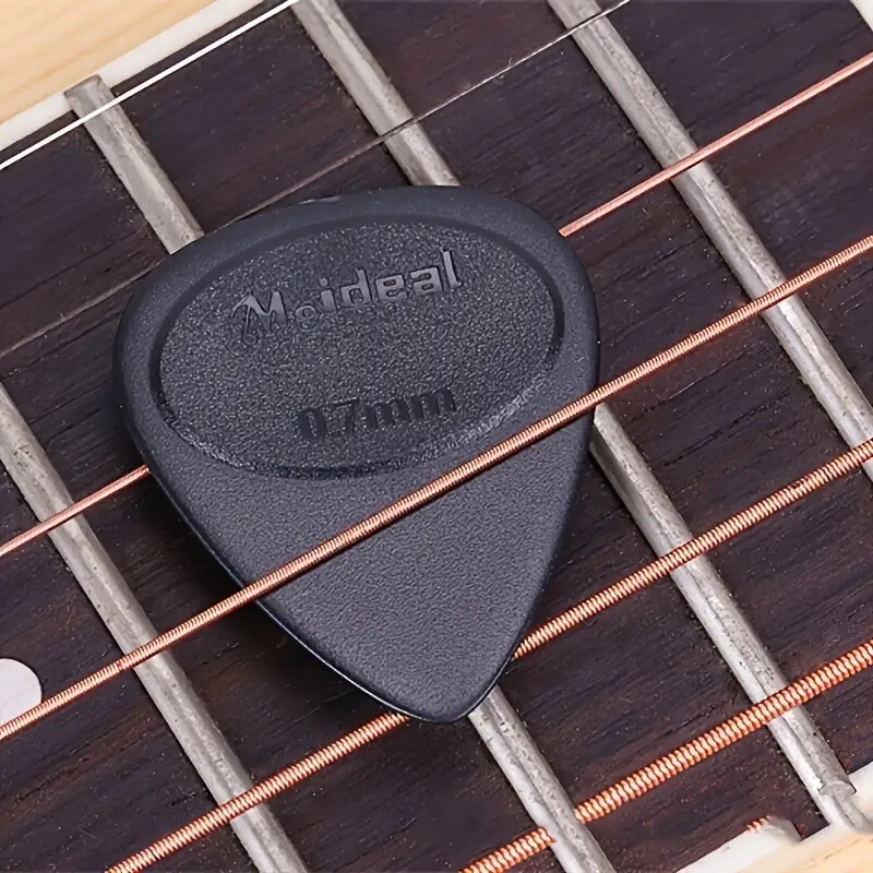 20 件黑色防滑吉他拨片 - 0.7 毫米厚，增强快速拨奏 - 非常适合原声吉他、电吉他和低音吉他 - 耐用材料，提高可玩性 商品详情 1