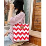 Chevro Patterned tote bag with red and white stripes and thick rope handles.   