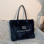black Triangle Project fluffy handbag features embroidered text on soft faux fur