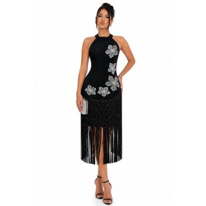 Designer Cocktail dress features intricate floral applique details and a dramatic fringe hem.