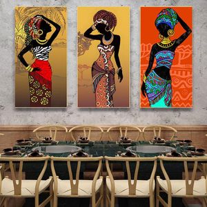 Three canvas murals of African women, decorative posters featuring ethnic tribal art figures.