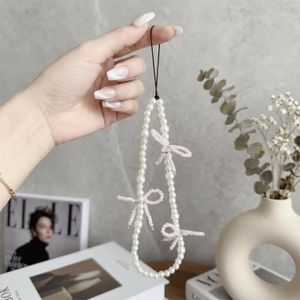 ShebSheb Beaded Phone Chain with Pink Bows, 18 cm / 7.09 in, Elegant Pearl‑Inspired Wrist Strap for Mobile, Chic Decorative Lanyard for Women & Girls