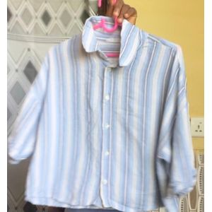 Top Campus Sutra women's boxy shirt featuring a blue and white striped pattern. 