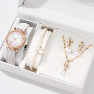 White pearl watches, necklaces, earrings, rings, bracelets - a set of five items.